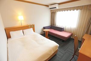 Postel nebo postele na pokoji v ubytování Hotel Castle Inn Ise Meotoiwa