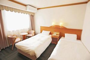 Postel nebo postele na pokoji v ubytování Hotel Castle Inn Ise Meotoiwa
