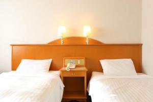Postel nebo postele na pokoji v ubytování Hotel Castle Inn Ise Meotoiwa