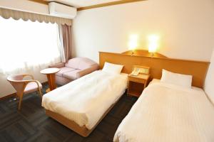 Postel nebo postele na pokoji v ubytování Hotel Castle Inn Ise Meotoiwa