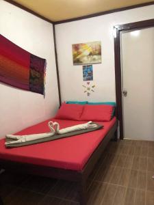 Voodi või voodid majutusasutuse el nido hostel sun valley toas