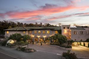 an aerial view of a house with a sunset at El Colibri Hotel & Spa in Cambria