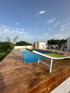 a swimming pool on the roof of a house at Villa Santo Stefano in Monopoli