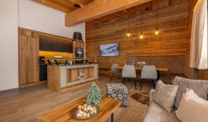 TV a/nebo společenská místnost v ubytování Bachgut - Das Resort am Berg