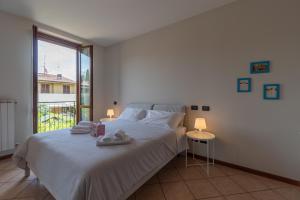 Postel nebo postele na pokoji v ubytování Montinelle Residence , Wi-Fi, Piscina e garage F&L Apartment + 43 fotografií