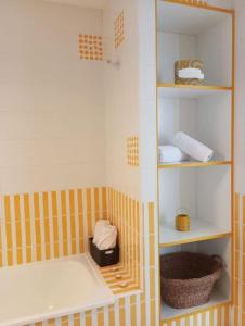 a small bathroom with a shower with a shelf at Atlantic Soul in Playa Blanca +32 photos