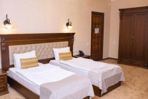 Postel nebo postele na pokoji v ubytování Hotel Imperial House