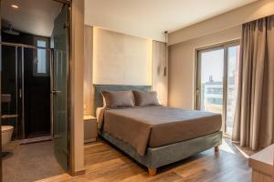 Ein Bett oder Betten in einem Zimmer der Unterkunft Wellnest Hotel