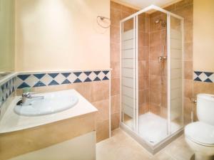 a bathroom with a shower and a sink and a toilet at Banana Beach in Marbella