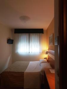 Postel nebo postele na pokoji v ubytování Hotel GF