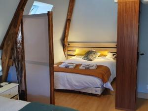Postel nebo postele na pokoji v ubytování Gite de Charme Gite du Hameau