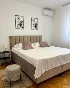 a large bed in a white room with a large bedvisor at Villa Marta in Murvica +37 photos