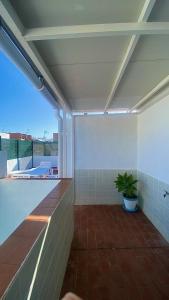 an empty patio with a plant on a building at Loving Mediterranean Home in Estepona
