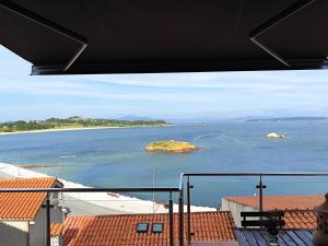 a view of the ocean from a balcony at Casa Boa Vista in San Pedro +37 photos