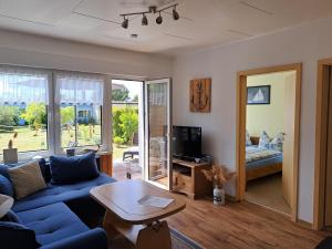 TV a/nebo společenská místnost v ubytování Bungalow 21