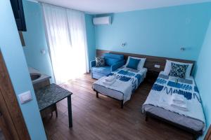 Postel nebo postele na pokoji v ubytování Villa Olympia + 37 fotografií