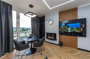 Televízia a/alebo spoločenská miestnosť v ubytovaní Luxury apartments GREAT