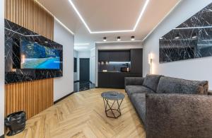 Televízia a/alebo spoločenská miestnosť v ubytovaní Luxury apartments GREAT