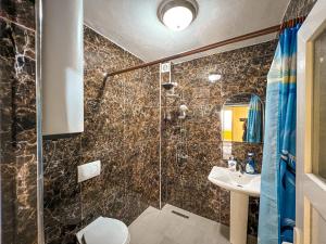 a bathroom with a shower and a sink at Dani Apartments, Albanian Alps, Tropoje in Kolgecaj