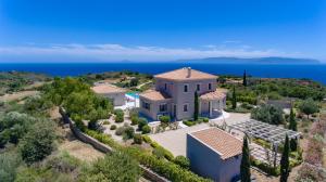 an aerial view of a villa with the ocean in the background at Villa Robola in Mavráta