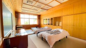 Postel nebo postele na pokoji v ubytování 馬籠ふるさと学校 Magome Furusato Gakkou + 37 fotografií
