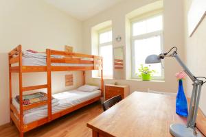 Postel nebo postele na pokoji v ubytování Nomado Hostel