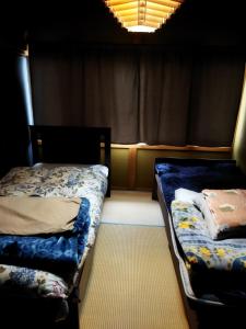 Postel nebo postele na pokoji v ubytování Private Twin Room in Ishinomaki, Non-Smoke, Free Parking, Cat Island, Wifi1
