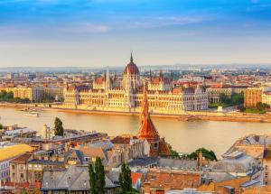 a view of a city with a river and a building at Verdi Budapest Aquincum in Budapest