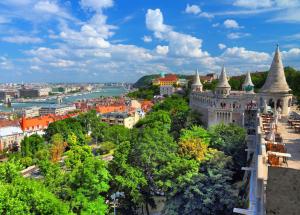 an aerial view of a city with trees and a castle at Verdi Budapest Aquincum in Budapest
