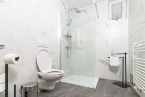 Koupelna v ubytování Hotel Center Bohinjsko Jezero + 37 fotografií