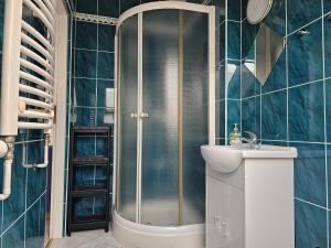 a bathroom with a shower and a sink at Pokoje u Marii in Międzyzdroje +60 photos