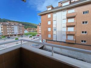 a view from the balcony of a building at Apartamento Ribadesella playa in Ribadesella +8 photos