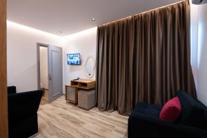 TV a/nebo společenská místnost v ubytování Rest Hour Hotel