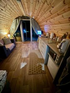 a small kitchen and living room in a tiny house at Knockmany View Glamping in Augher
