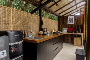 a kitchen with a sink and a counter top at Calidas Hill in Kintamani