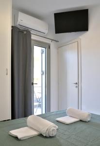 Postel nebo postele na pokoji v ubytování Helios Studios & Apartments