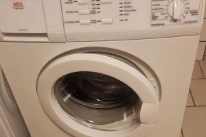 a close up of a washing machine at Moderne, ruhige Ferienwohnung! in Geistingen