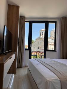 TV a/nebo společenská místnost v ubytování Treva Hotel & Apartaments