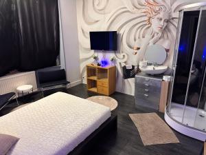a bedroom with a bed and a sink and a mirror at Chambre Neptune in Brussels