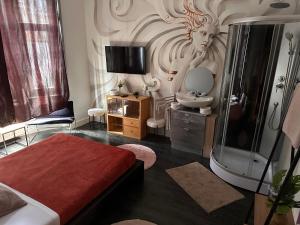 a bedroom with a bathroom with a shower and a sink at Chambre Neptune in Brussels