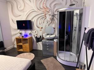 a bathroom with a shower and a sink and a mirror at Chambre Neptune in Brussels