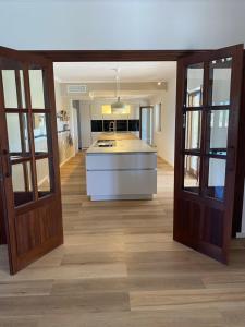 a kitchen with an island in the middle of a room at Finca Leilani in Llucmajor