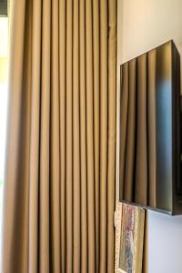 TV a/nebo společenská místnost v ubytování Hercules Sea View