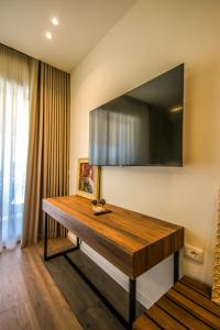 TV a/nebo společenská místnost v ubytování Hercules Sea View