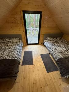 Postel nebo postele na pokoji v ubytování Domek rekreacyjny DORAN