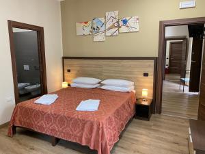 Postel nebo postele na pokoji v ubytování B&B Duomo Apartament