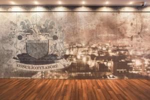 a room with a wall with a mural of a city at Motel One Manchester-Piccadilly in Manchester