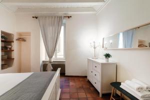 Postel nebo postele na pokoji v ubytování Pardo Apartments by Quokka 360 - Locarno old town