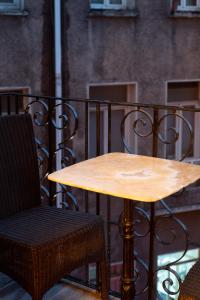 a wooden table and a chair on a balcony at hotel di poesia deluxe in Istanbul