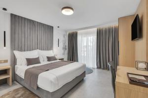 Posteľ alebo postele v izbe v ubytovaní Hotel Laurentum